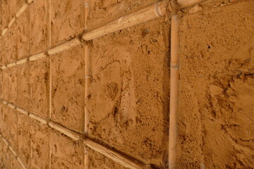 Wall made of bonded bamboo tubes with barun cement clay, Alter do Chao, State of Pará, Brazil.