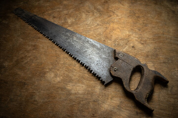 An old metal wood file with a wooden handle on a vintage background.