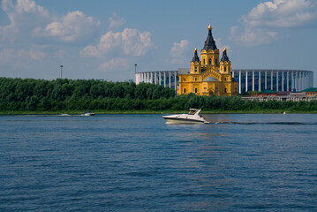 Speedboat on the river. Architectural views. Stadium and temple