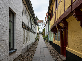 Colorful half timbered living houses in a row along the Herrenstall street in old town of Flensburg, Germany