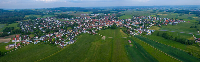 Fototapeta na wymiar Aerial view of the village Langensendelbach in Germany, on a cloudy day in spring.
