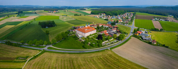 Aerial around the International meeting monastery Speinshart in Germany, Bavaria on a sunny day in...