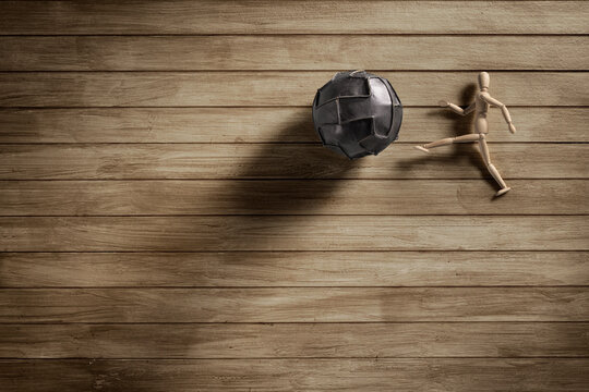 Top view of a living room with a ball and wooden mannequin