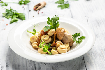 Canned mushrooms with pepper and parsley on wooden background, Restaurant menu, dieting, cookbook recipe