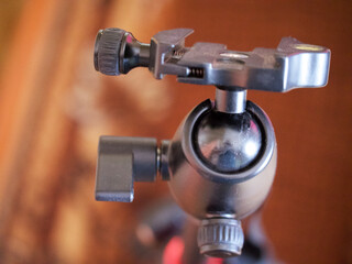 Tripod head for the camera, close-up. A tripod head is the part of a tripod system that attaches...