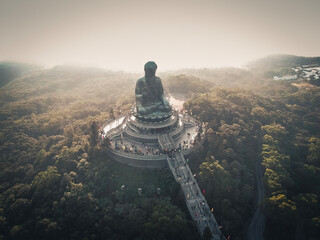 buddha statue in front of the temple - obrazy, fototapety, plakaty