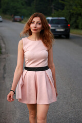 Slim woman walking in the street