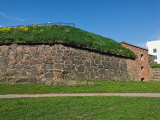 The wall of the Panzerlaks Bastion, built in the 16th century, in the city of Vyborg on a clear...