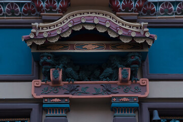 A tea house canopy with dragon statues by summer day