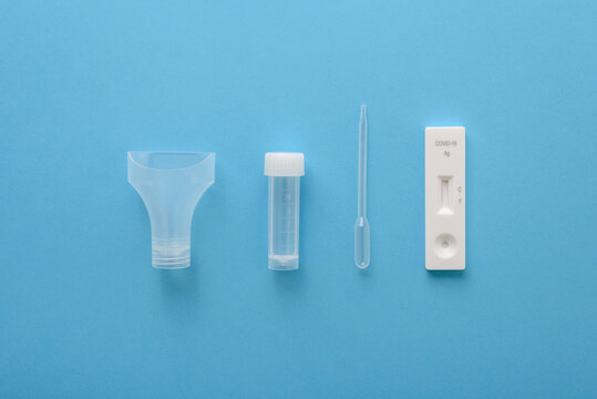 Covid19 antigen test kit with cassette, pipette and plastic bottle for saliva