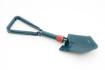 Folding camping shovel on the white background.