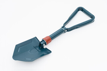 Folding camping shovel on the white background.