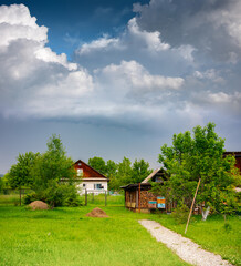 Fototapeta na wymiar Rustic landscape in July before a thunderstorm
