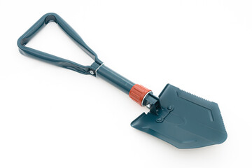Folding camping shovel on the white background.
