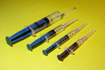 Close-Up Of Syringe On Black Background