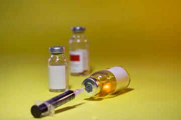 Coronavirus Covid-19 vaccine with syringe isolated on Dark background