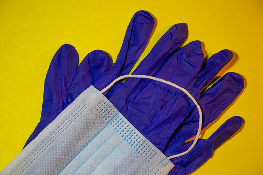 Still Life Of A Face Mask And Blue Protective Gloves