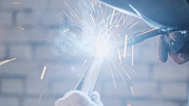 Process of welding two parts of the detail together - glow and sparkles