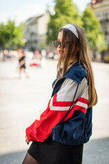 Beautiful country girl in 90s style. Back in time 90s 80s. Stylish girl in retro colourful vintage...