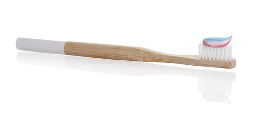 Wooden brush with toothpaste isolated on white