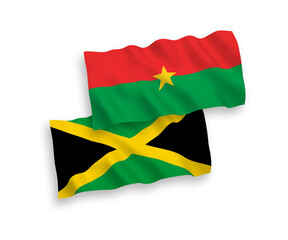 National vector fabric wave flags of Burkina Faso and Jamaica isolated on white background. 1 to 2 proportion.