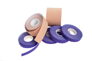 Set of different size lifting or kineio tape rolls on white background
