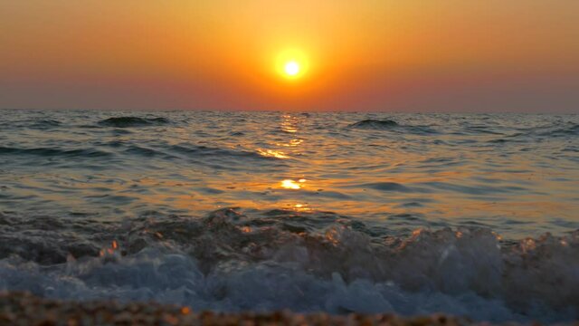 Sunrise over the sea. Morning on the ocean. Sunny path on the waves.