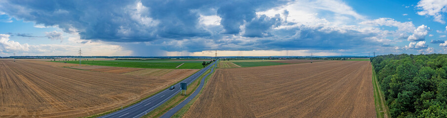 Drone panorama of a thunderstorm with rain and dramatic cloud formations over Leeheim in the Hessian Ried region