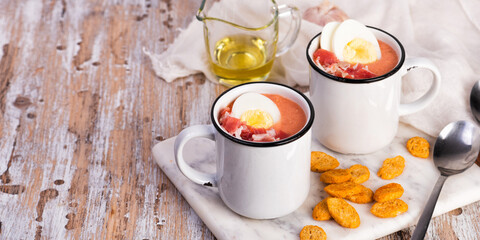 Spanish salmorejo cream soup with ham and egg