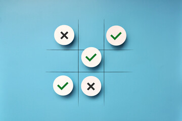 Tic-tac-toe game with ticks and crosses. A symbol of agreement with something