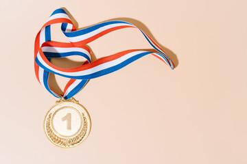 gold medal on pastel background.award and victory concept.copy space