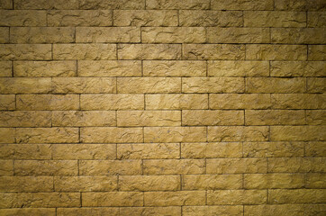 Yellow bricks pattern on wall for abstract background.