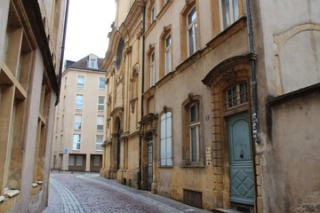 alley, ancient stone houses and trinitaires church in metz in lorraine (france) 