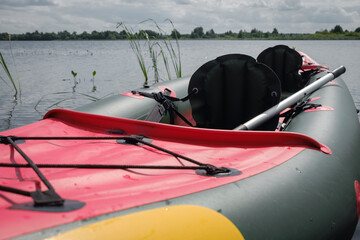 Kayaking on the Lake Concept Photo. Sport Kayak on the Rocky Lake Shore.fishing and hunting recreation