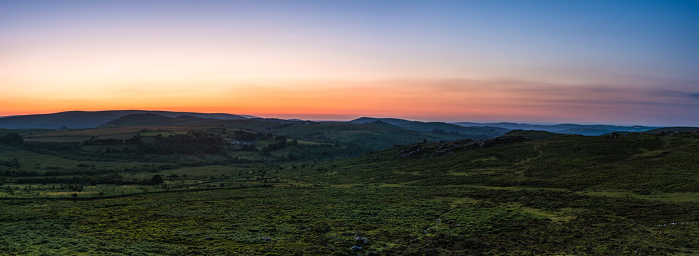Sunset over fields in Haytor Rocks, Dartmoor Park, Devon, England