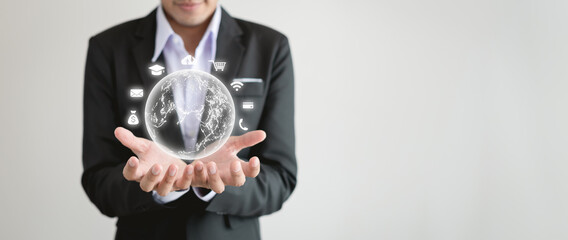 Smart business man in suit holding digital globe icon on white background. Modern payment network interface global network connection icon digital and communication Cloud and online security.
