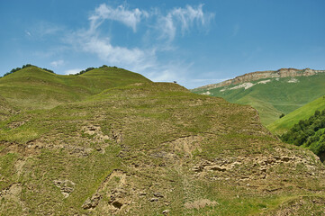 Obraz premium Scenic view of green meadows Dagestan, Russia