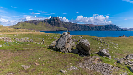 A view from the old lighthouse at Neist Point across the bay on the island of Skye, Scotland on a summers day