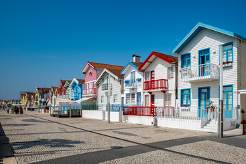 Fototapeta na wymiar Street with colorful striped houses typical of Costa Nova, Aveiro, Portugal.
