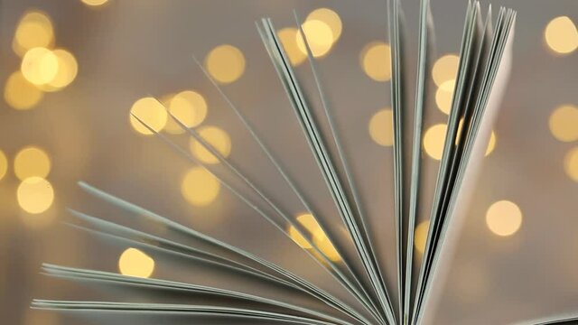 Book close-up.Reading of books. Book pages close-up in warm colors. Panorama .Winter books. Christmas books.Winter cozy reading.Book of fairy tales
