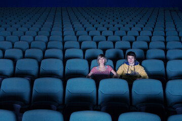 Couple in empty movie theater