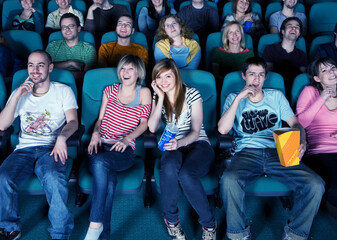 Fototapeta premium Smiling audience in movie theater