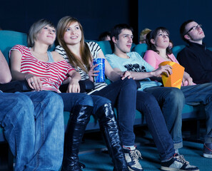 Obraz premium Smiling audience in movie theater