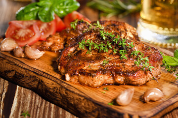  Fried pork steak on a wooden board