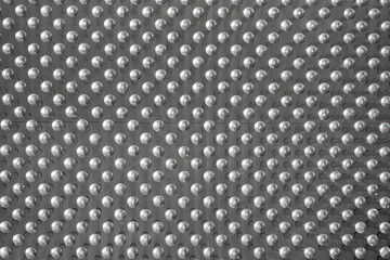 Interactive contact pinscreen panel with plastic pins, closeup photo