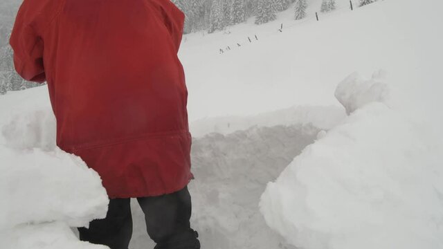 Snow igloo building in the high winter mountains