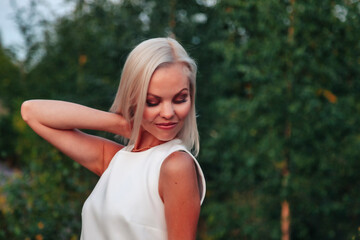 Outdoors portrait adult woman on nature walking in summer forest