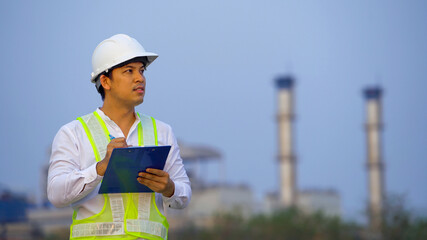 Male Engineer working on site at factory industry