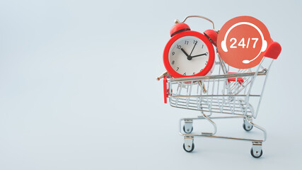 red round paper cut with contact 24 hours 7 days and alarm analog clock on   shopping cart on blue background, for non stop service concept