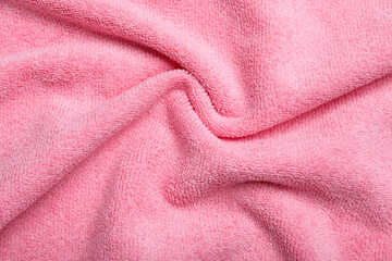 Crumpled pink microfiber cloth as background, closeup